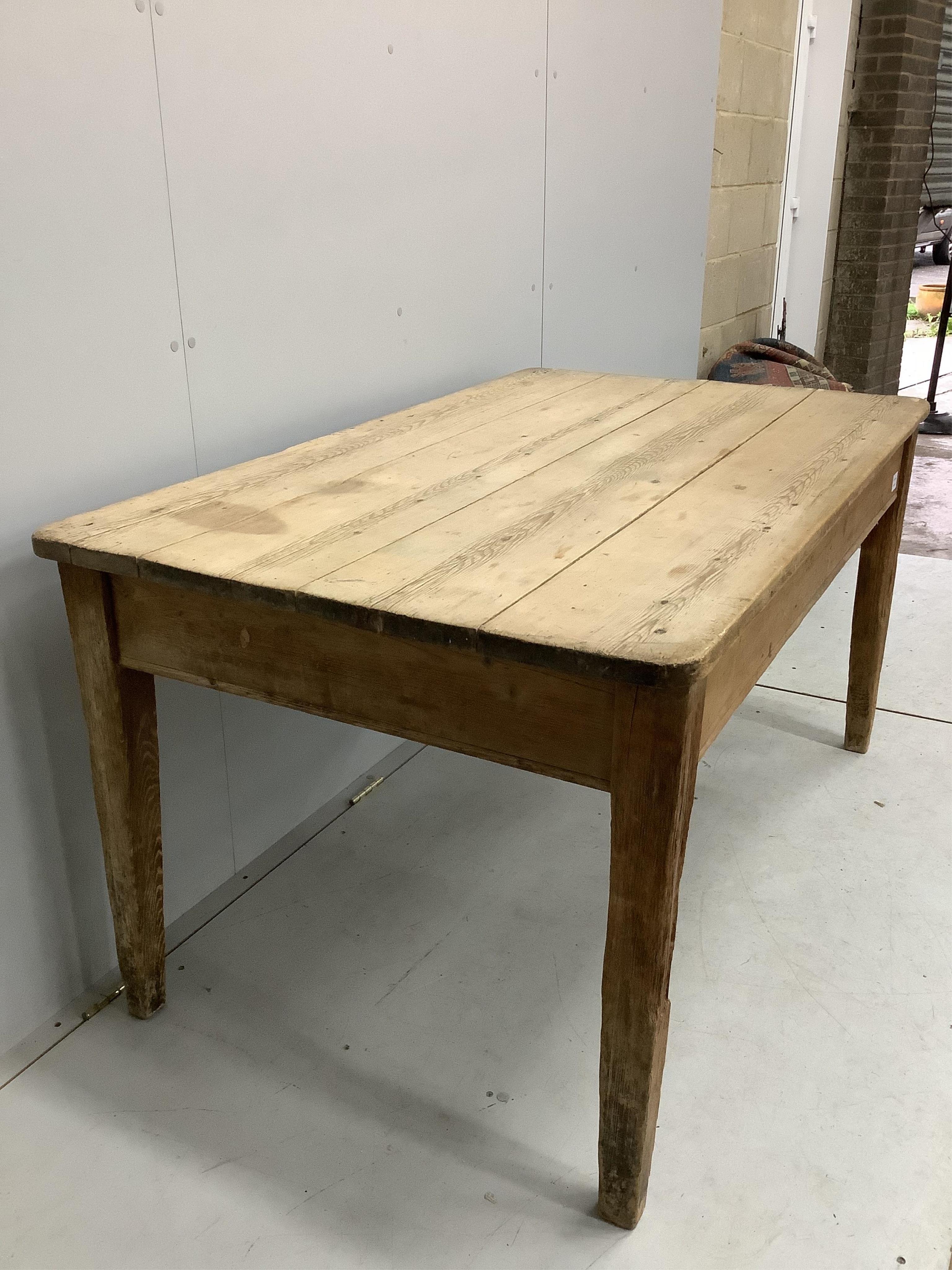 A 19th century rectangular scrubbed pine kitchen table fitted drawer on square tapered legs, width 144cm, depth 85cm, height 73cm. Condition - fair